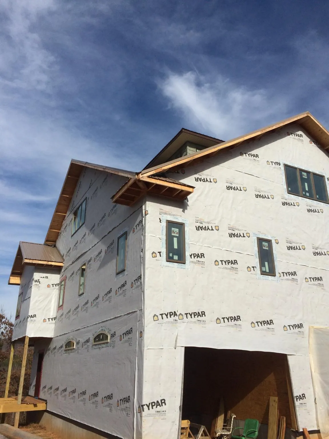 Stick built house wrapped in Typar with new roof framing and dormers in Hanoverton